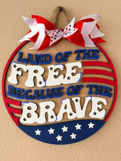 Land of the Free, Because of the Brave Sign